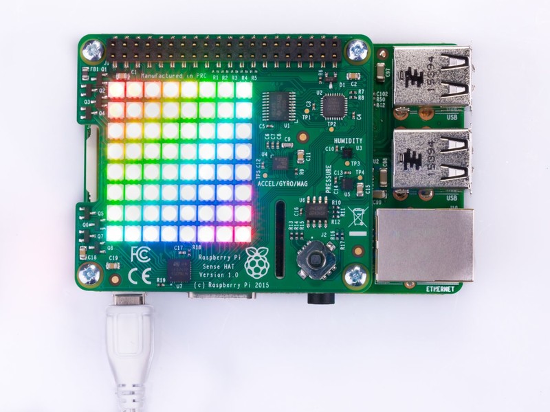 Raspberry Pi Sense HAT on a Raspberry Pi with the LED matrix lit